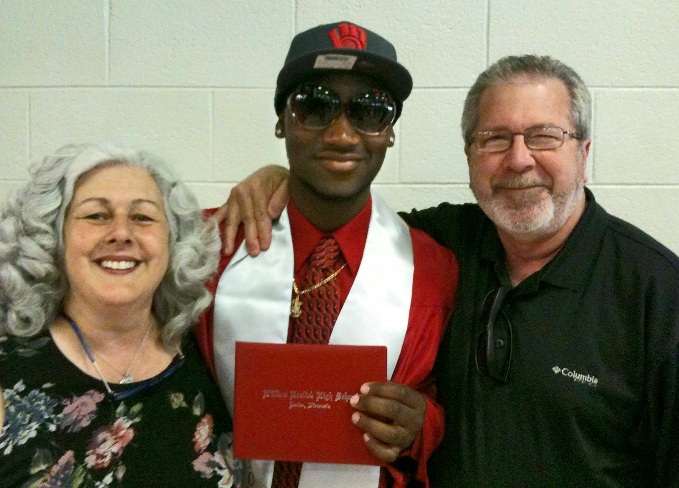Jermaine Cemon ( center) with parents