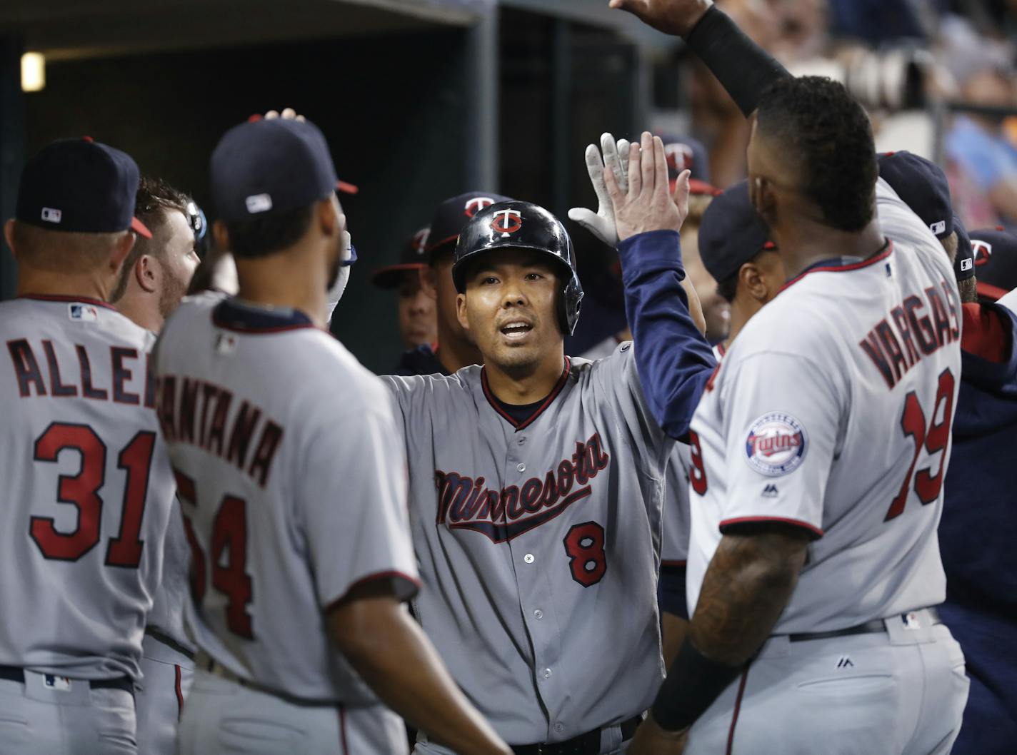 Minnesota Twins' Kurt Suzuki (8) celebrates his solo home run against the Detroit Tigers in the fourth inning during a baseball game in Detroit, Monday, Sept. 12, 2016. (AP Photo/Paul Sancya)