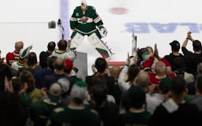 Wild fans salute goalie Marc-André Fleury at the end of the game Thursday night. Fleury is retiring after this season, his 21st in the NHL.