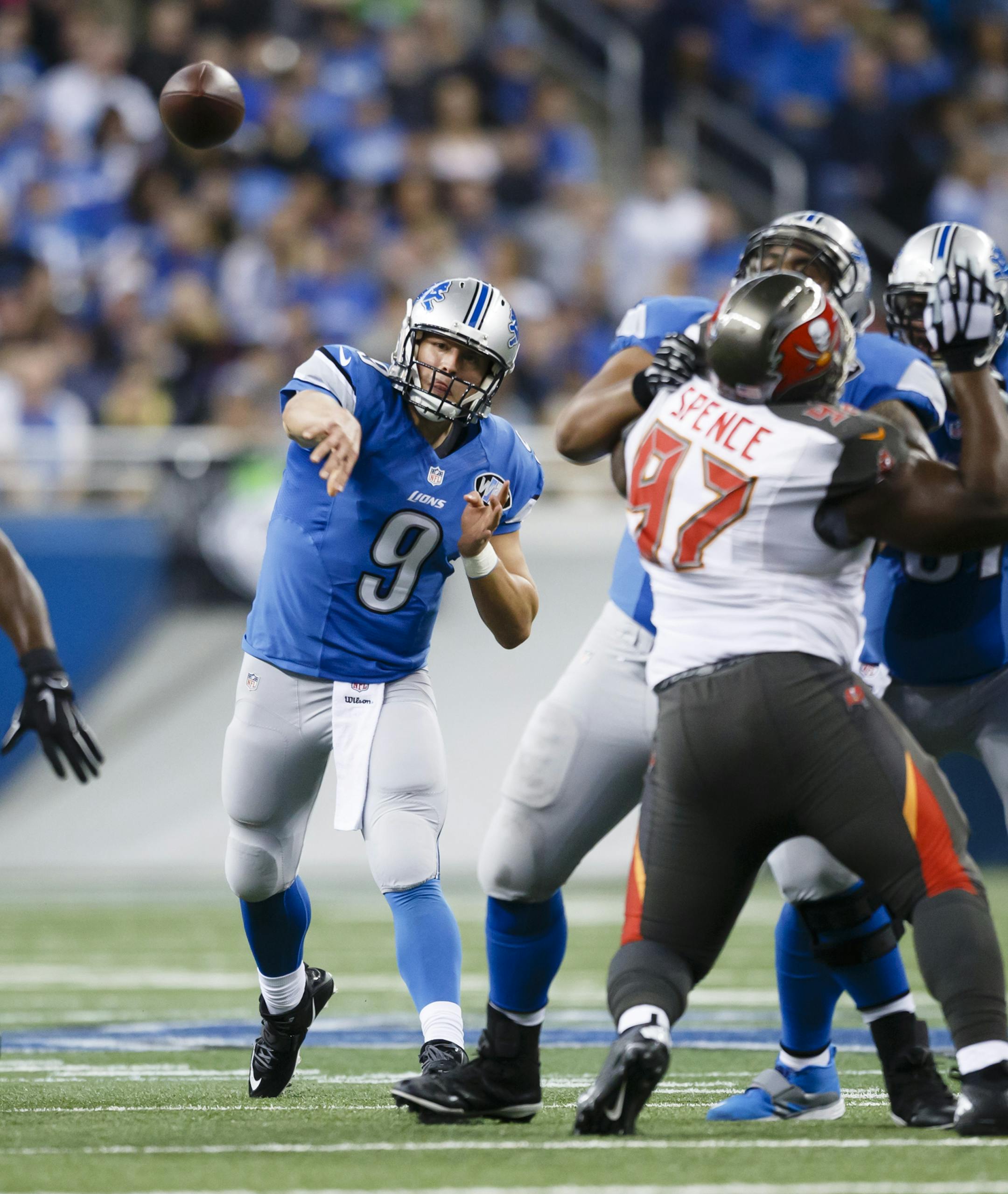 Detroit Lions quarterback Matthew Stafford (9) passes against the Tampa Bay Buccaneers during an NFL football game at Ford Field in Detroit, Sunday, Dec. 7, 2014. (AP Photo/Rick Osentoski)