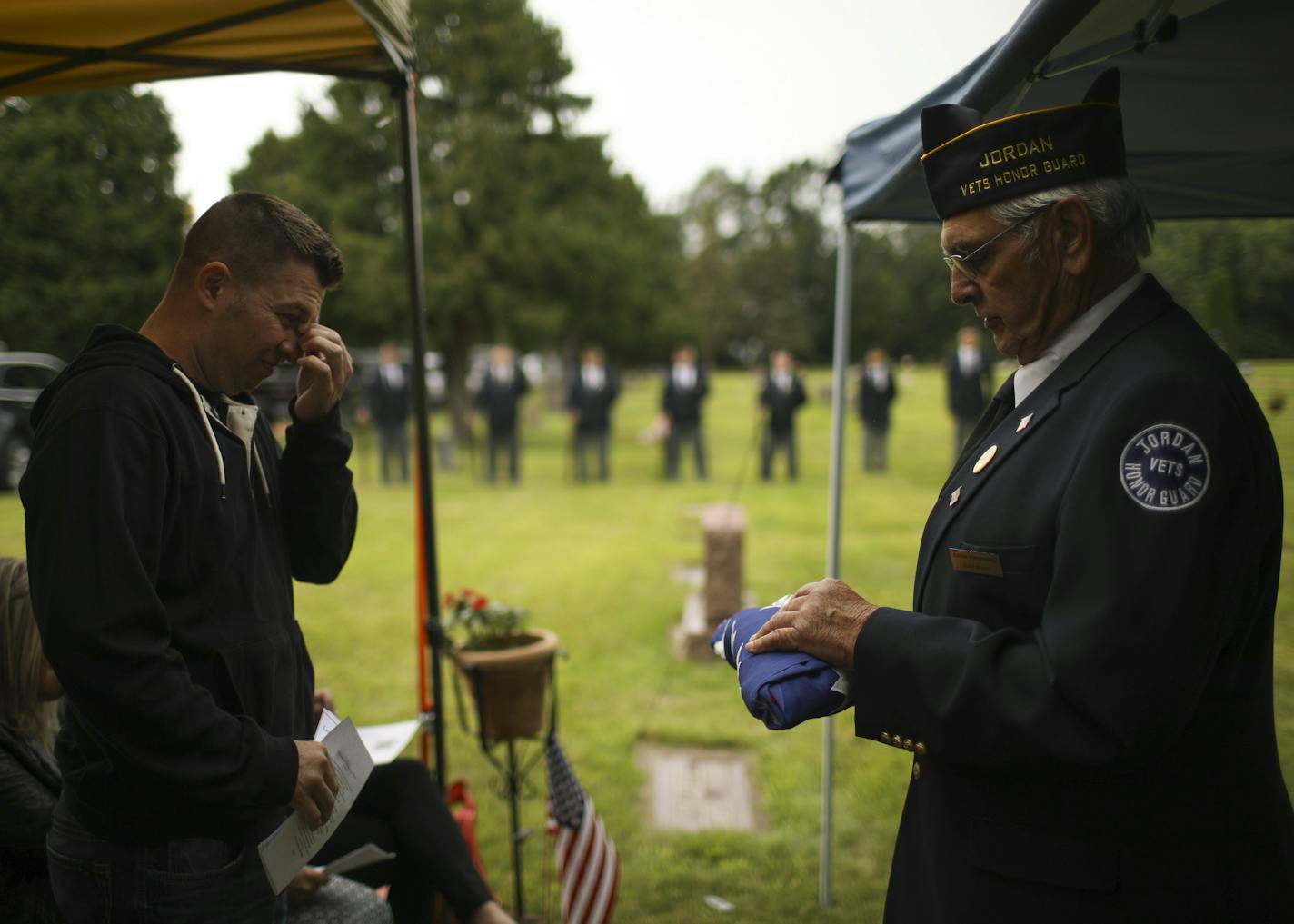 Jordan Vets Honor Guard representative Butch Mamer prepared to present Jesse Richard with the American flag displayed during the memorial service for his father, Thomas Breunig Thursday evening in Jordan. ] JEFF WHEELER &#xef; jeff.wheeler@startribune.com Jesse Richard went through life never knowing his father. He was only a few months old when his father, Thomas Breunig, was one 13 Marines who died in a river of fire that engulfed his barracks in Japan in October 1979. On a chilly Thursday eve