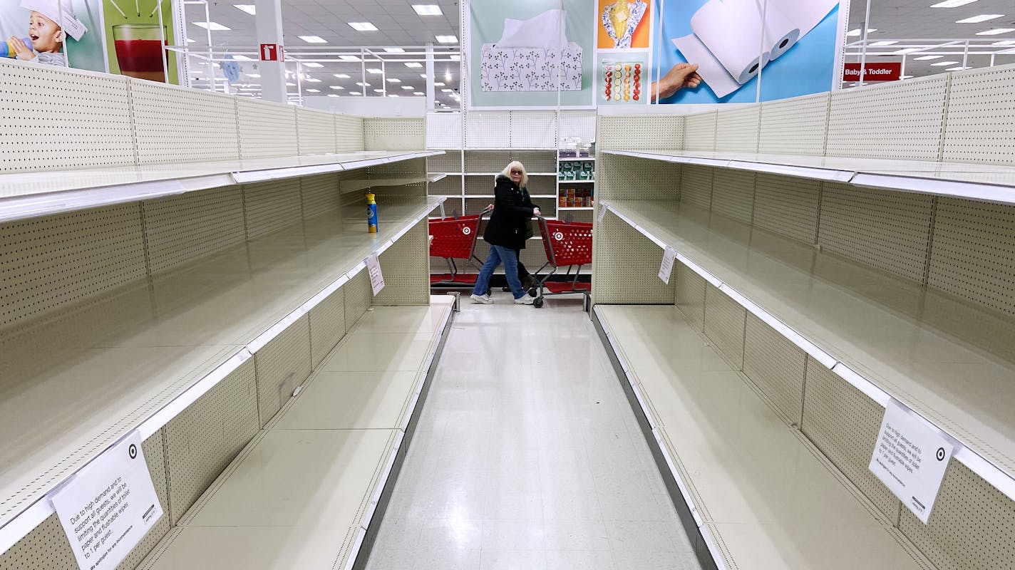 Shoppers bought out all of the stock of toilet paper, disinfecting wipes, and hand sanitizer in response to the Coronavirus, prompting a limit on several items, Friday at the Target in Columbia Heights. ] ANTHONY SOUFFLE &#x2022; anthony.souffle@startribune.com Shoppers bought out all of the toilet paper, disinfecting wipes, and hand sanitizer in response to the Coronavirus, prompting a limit on several items, Friday, March 13, 2020 at the Target in Columbia Heights, Minn.