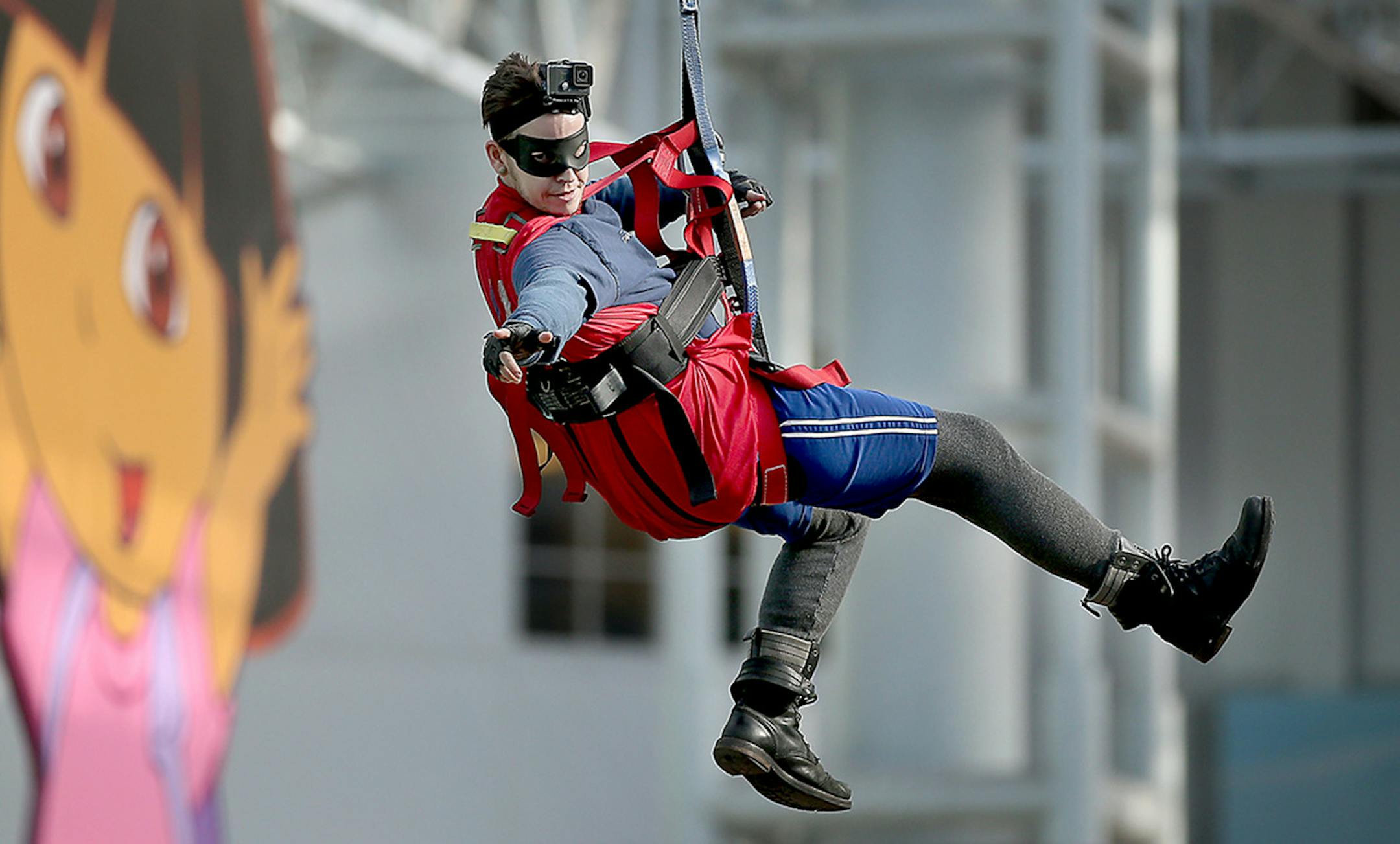 St. Paul Preparatory School Social Studies teacher P.J. (Patrick) Wiggin rode as "Econ Man," from high above the Mall of America's Zip Line, Thursday, November 13, 2014 in Bloomington, MN. ] (ELIZABETH FLORES/STAR TRIBUNE) ELIZABETH FLORES &#x2022; eflores@startribune.com