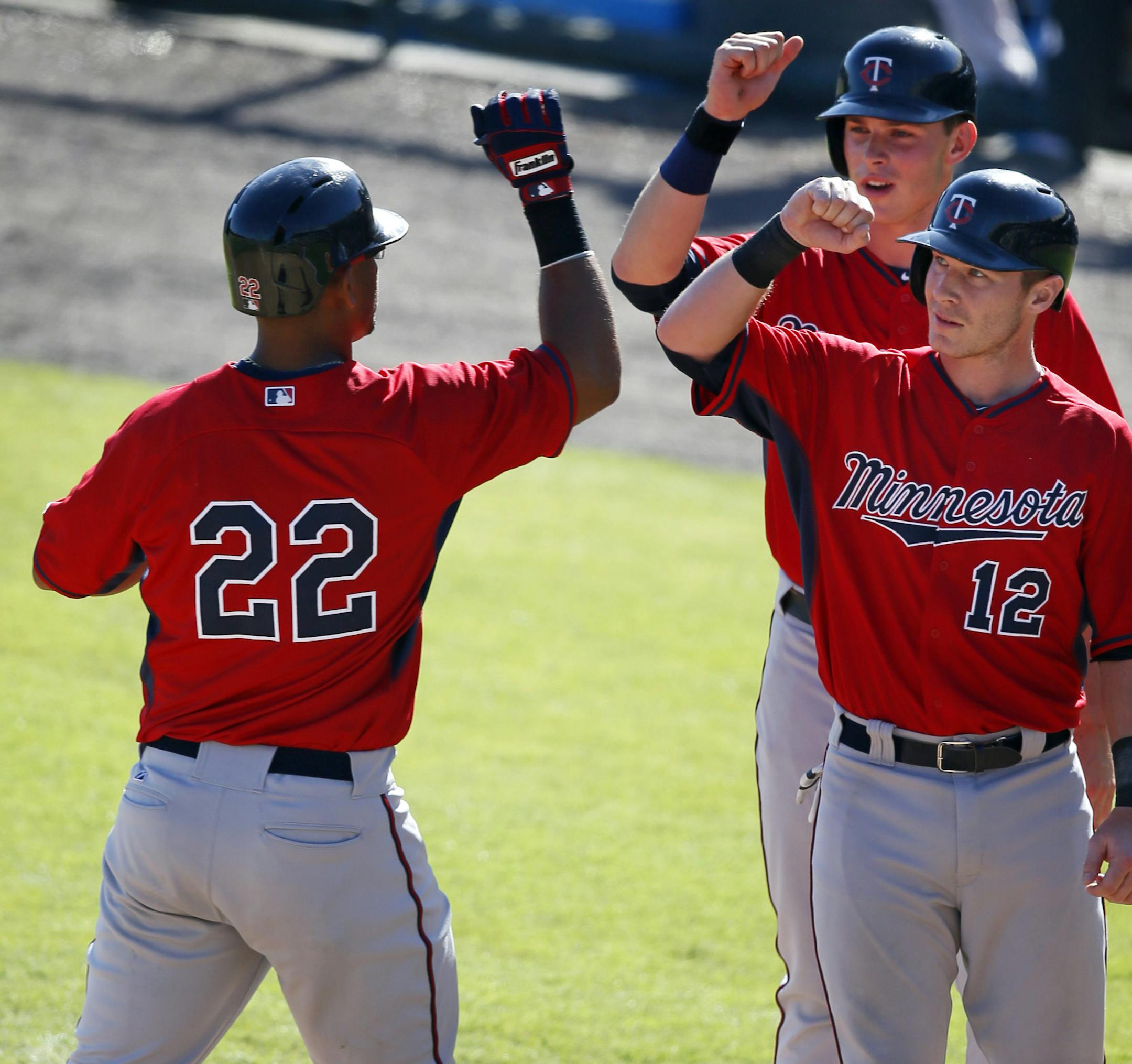 Wilkin Ramirez left celebrated his 3 run homer in the ninth inning with Max Kepler and Chris Hermann Monday March 3, . 2014 game between the Minnesota Twins at Baltimore in Sarasota , Florida. Twins beat Orioles 9-2 JERRY HOLT jerry.holt@startribune.com Jerry Holt
