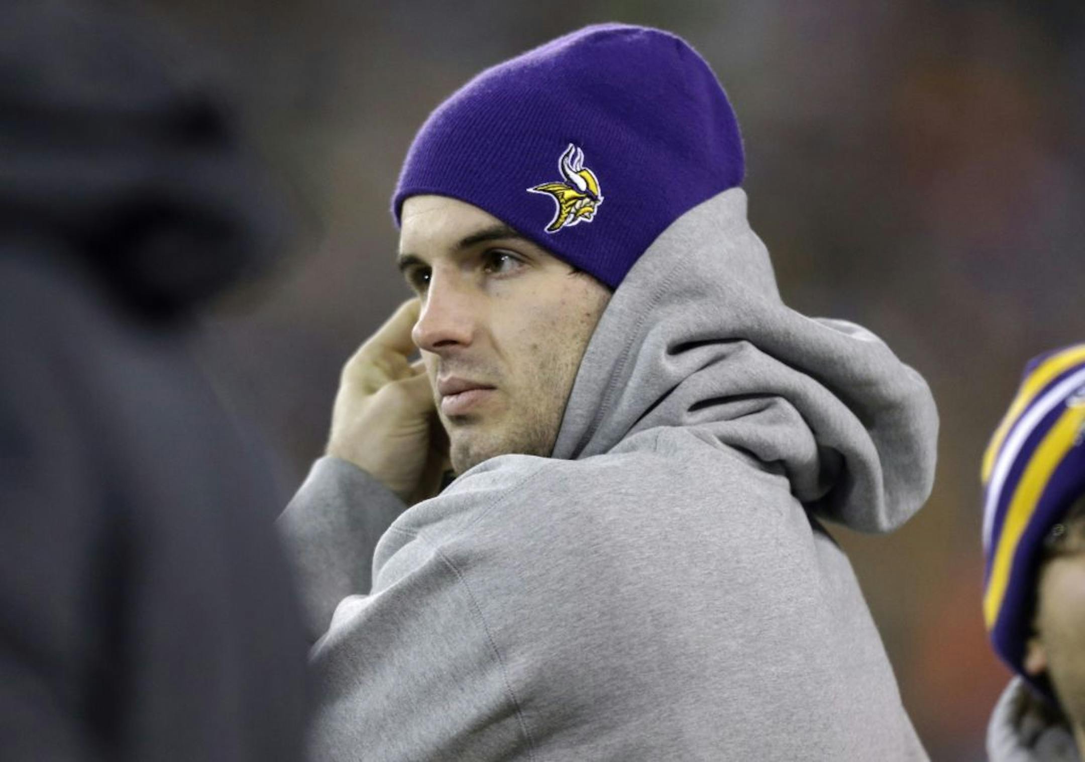 Minnesota Vikings quarterback Christian Ponder watches from the sideline.