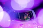 Oakley Romanecz, 5, and Graham Romanecz, 3, left and right, from Prior Lake, Minn., looked out the window of their family's car at the light displays 