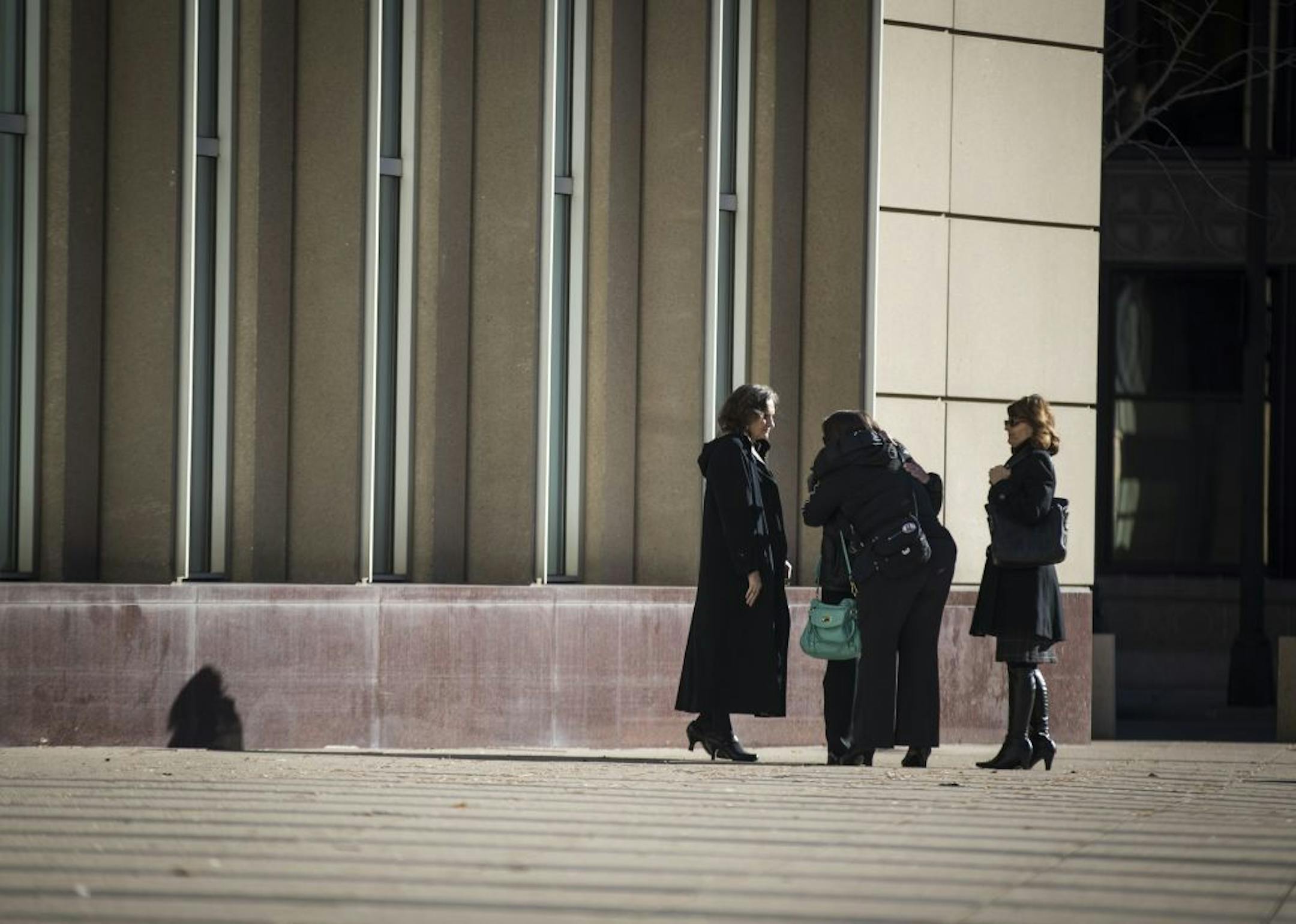 People hugged outside the U.S. Courthouse on Monday morning shortly after the sentencing for Danny Heinrich on November 21, 2016, in Minneapolis, Minn.