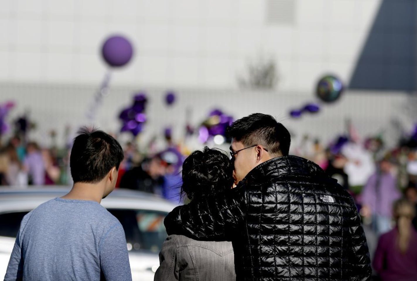 Warren Fan of Lakeville kissed his wife, Angie, as they along with Warren's brother Darren took in the scene Friday outside Paisley Park Studios in Chanhassen.