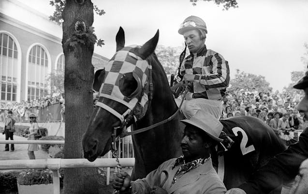 Jockey Ron Turcotte sits on Secretariat on their way from the paddock area to the track at Belmont Park on June 9, 1973. Secretariat won the Belmont S