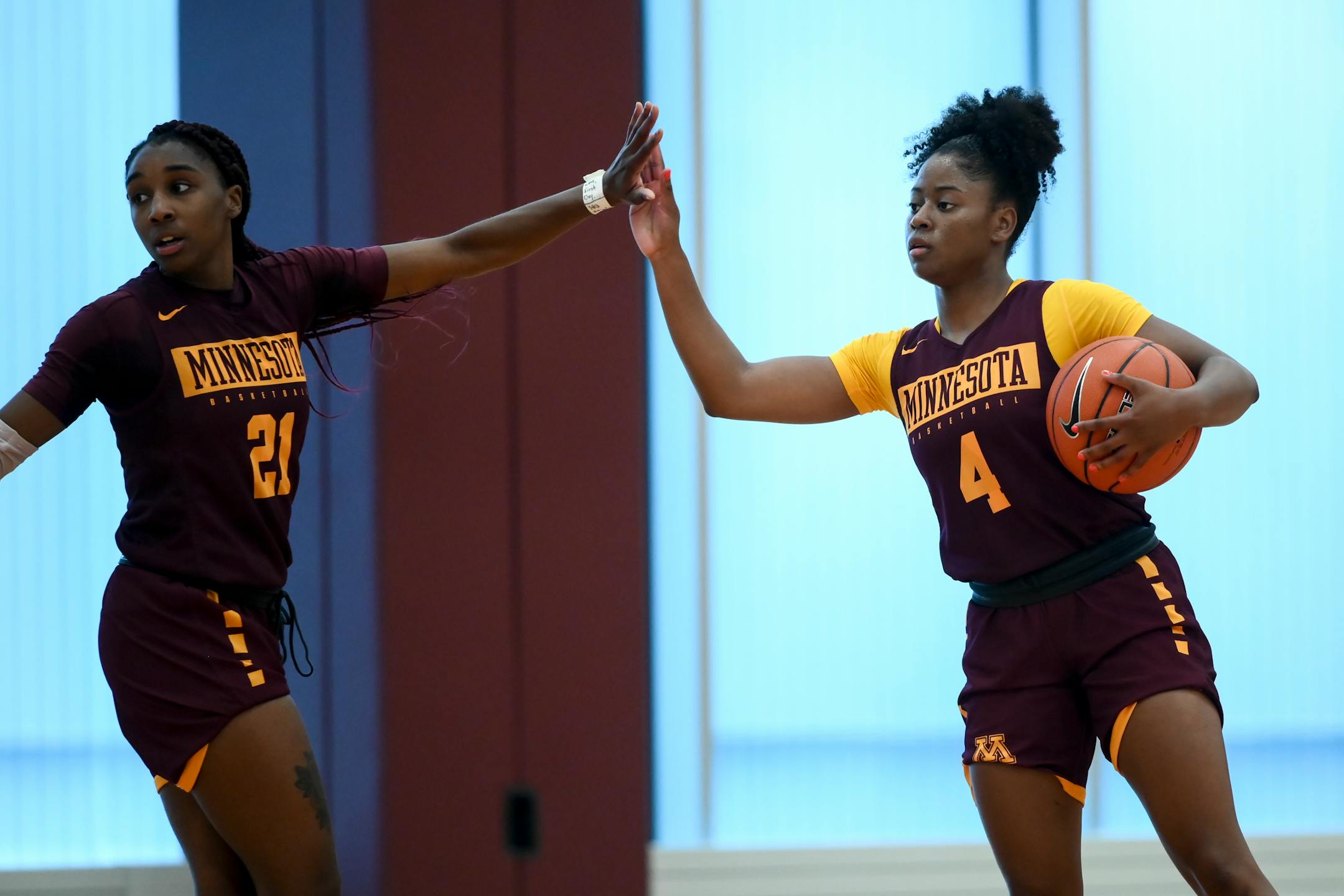Jasmine Brunson (21) high fived Jasmine Powell during a Gophers team workout in September.