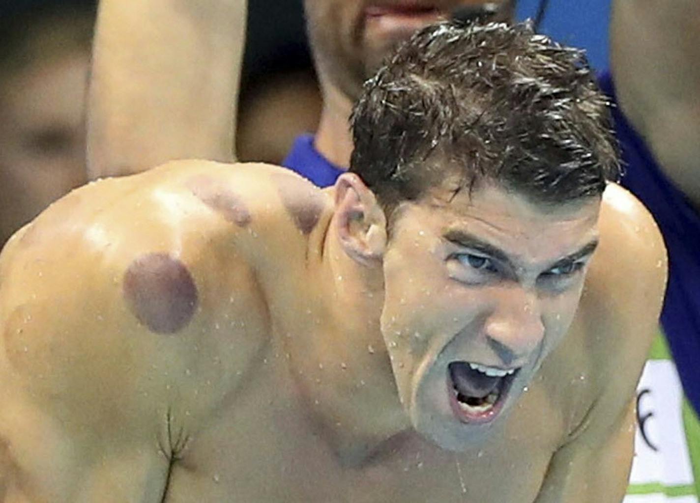 FILE - In this Aug. 7, 2016, file photo United States swimmer Michael Phelps encourages his teammates in the final of the men's 4x100-meter freestyle relay during the swimming competitions at the 2016 Summer Olympics in Rio de Janeiro, Brazil.