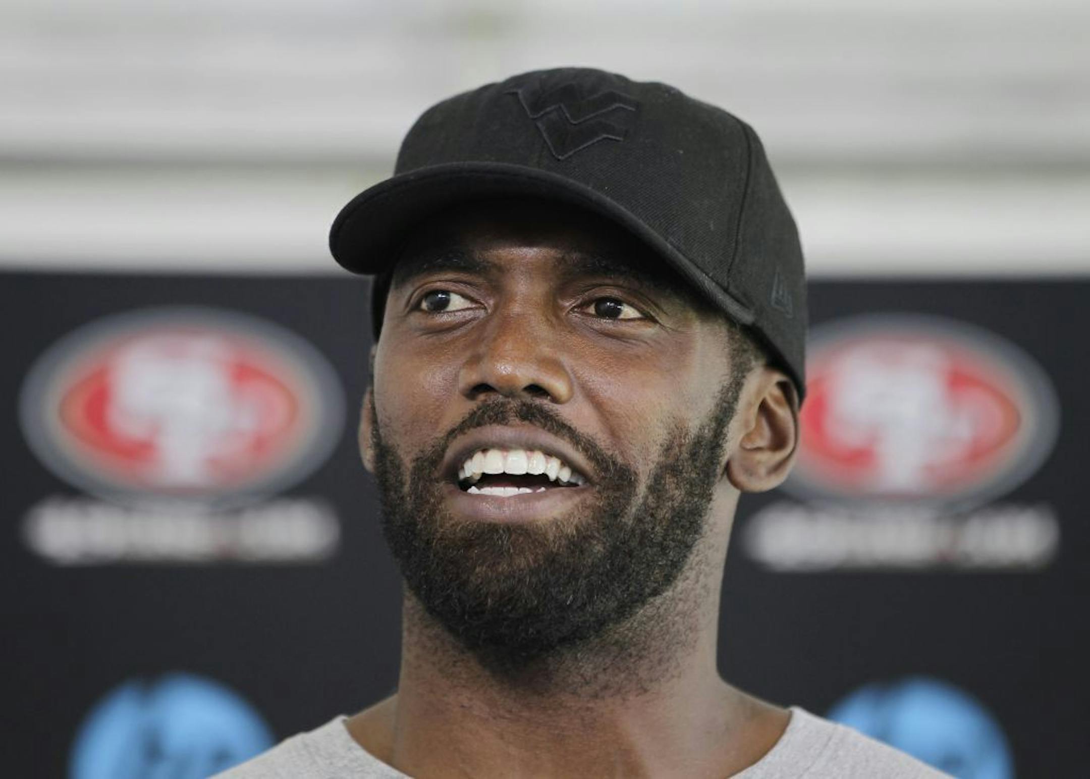 Ex-Viking Randy Moss appears to have grown up under 49ers coach Jim Harbaugh.