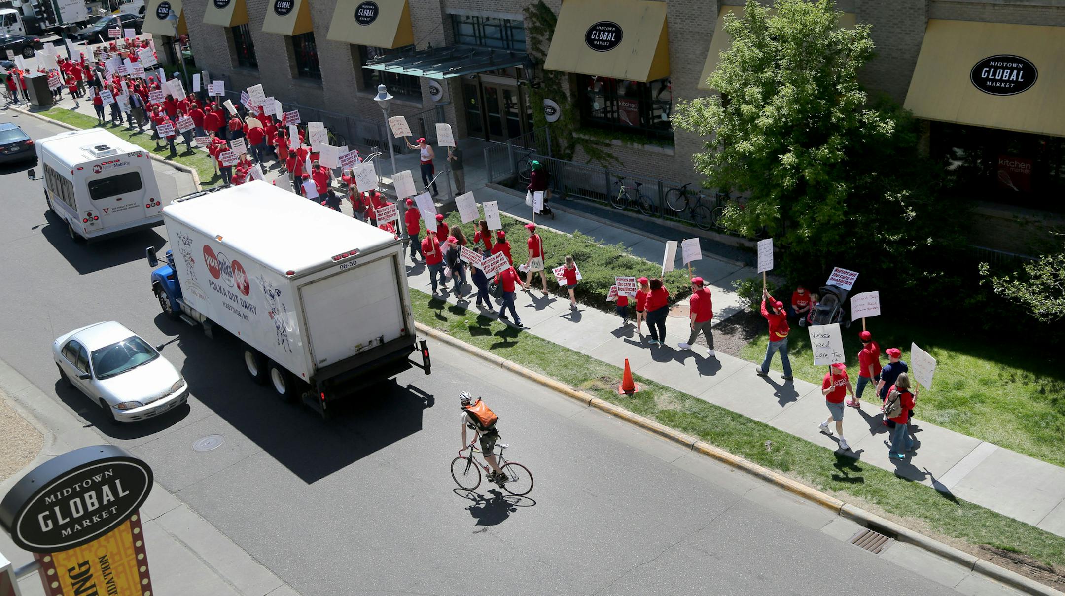 Nurses with Allina Health held an informational picket Wednesday as talks between their union and health system leaders have broken down over health insurance. Here, seen from the third floor of a nearby parking ramp, a large group of nurses is seen picketing outside the Allina Commons at the Global Market Wednesday, May 18, 2016, in Minneapolis, MN.](DAVID JOLES/STARTRIBUNE)djoles@startribune Nurses with Allina Health are planning an informational picket Wednesday as talks between their union a