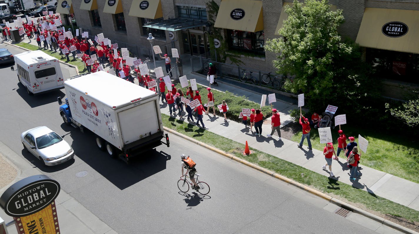 Nurses with Allina Health held an informational picket Wednesday as talks between their union and health system leaders have broken down over health insurance. Here, seen from the third floor of a nearby parking ramp, a large group of nurses is seen picketing outside the Allina Commons at the Global Market Wednesday, May 18, 2016, in Minneapolis, MN.](DAVID JOLES/STARTRIBUNE)djoles@startribune Nurses with Allina Health are planning an informational picket Wednesday as talks between their union a