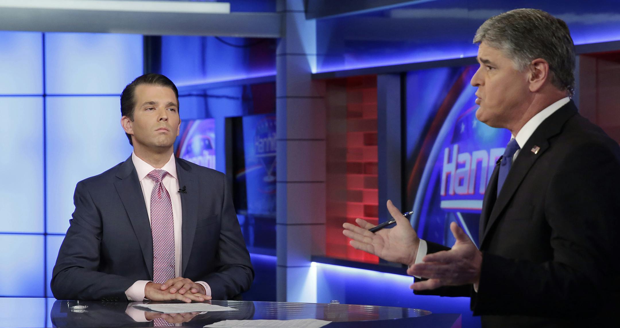 Donald Trump Jr., left, is interviewed by host Sean Hannity on his Fox News Channel television program, in New York Tuesday, July 11, 2017. (AP Photo/Richard Drew) ORG XMIT: MIN2017071213431116