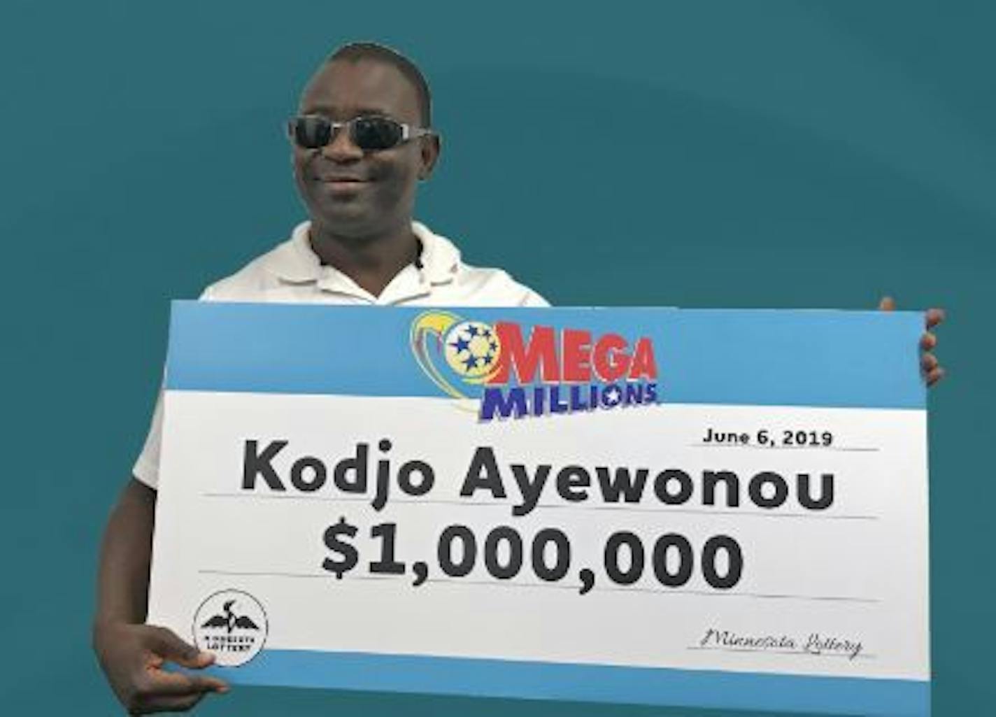 Kodjo Ayewonou, of Coon Rapids, stepped forward last week with a Mega Millions lottery ticket worth $1 million before taxes. Credit: Minnesota Lottery