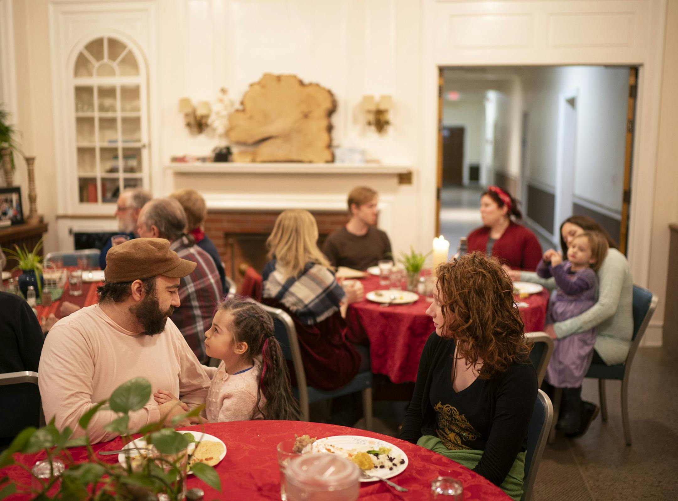 At the Monterey Cohousing Community in St. Louis Park, members dine communally once or twice a month.Scott Zien Edgar spoke with his daughter, Avadya, 5, while he was eating with Cleo Murphy Dennison, 15, during the communal meal in January.