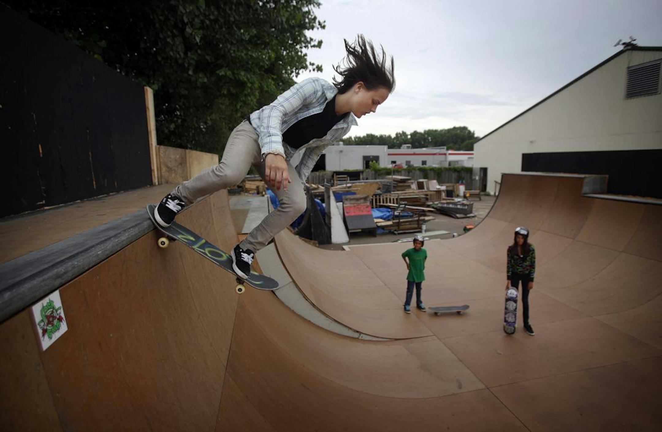 Anna Reese, 17, of Edina, dropped into a large outdoor halfpipe at 3rd Lair in Golden Valley, where she coaches at a youth camp. Minneapolis wants to draw skateboarders to parks through a partnership with City of Skate.