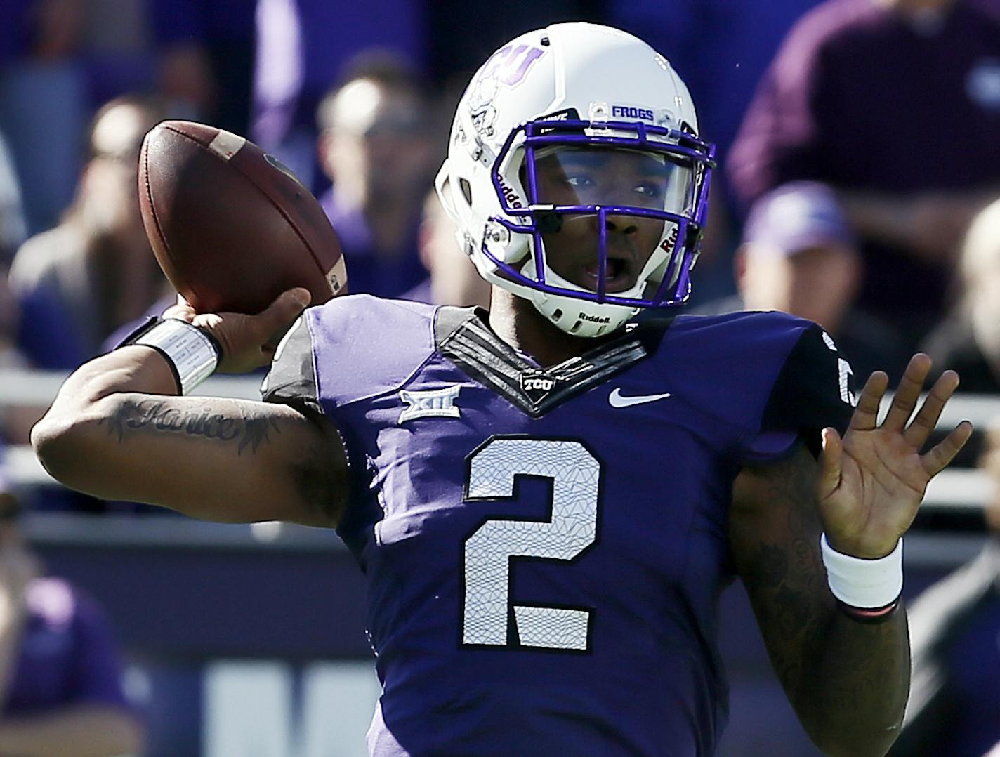 TCU quarterback Trevone Boykin (2) looks to throw to a receiver during the first half of an NCAA college football game against Iowa State at Amon G. Carter Stadium, Saturday, Dec. 6, 2014, in Fort Worth, Texas. (AP Photo/Brandon Wade) ORG XMIT: TXBW102