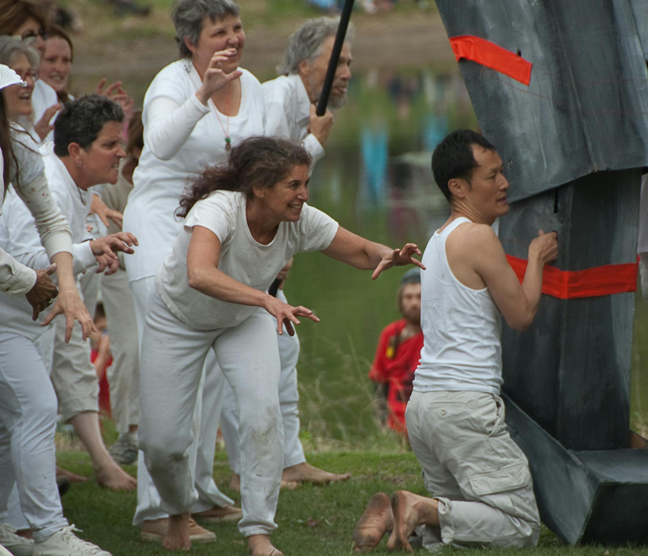 May Day parade puppeteer Esther Ouray (center, ponytail) has what it takes to handle a giant puppet like this tiger, with a little help from her friends. Photo by Liz Welch.