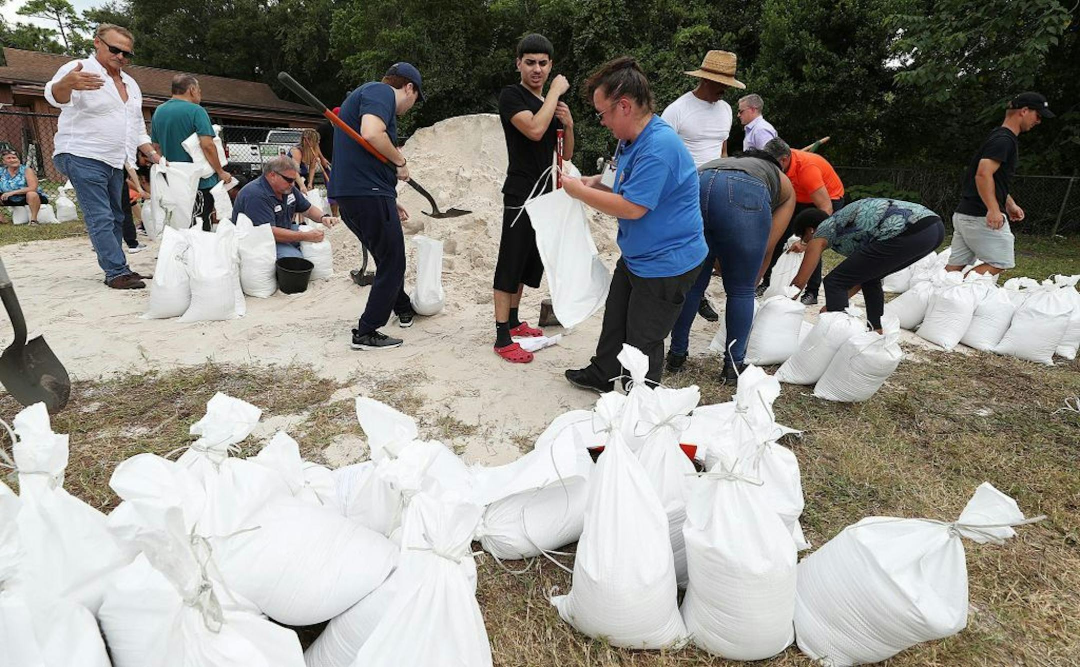 Dozens of Orange County residents fill sandbags at Blanchard Park in Orlando, Fla. on Wednesday, Aug. 28, 2019. The sandbags are being offered in advance of Hurricane Dorian, which is forecast to likely hit Florida. Orange County residents may get up to 10 sandbags at the location.