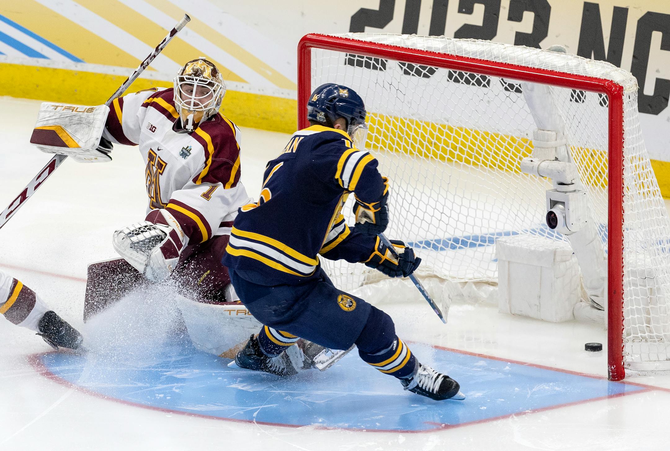 Jacob Quillan (16) of Quinnipiac scores the game winner in overtime period.