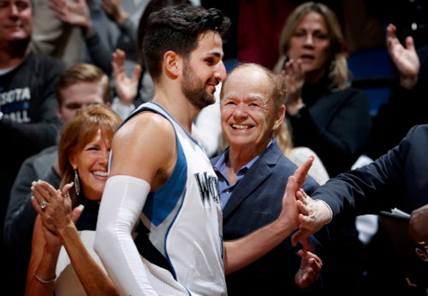 Timberwolves guard Ricky Rubio heard the cheers from fans -- including owner Glen Taylor, right -- after setting a franchise record with 19 assists against Washington on March 13.