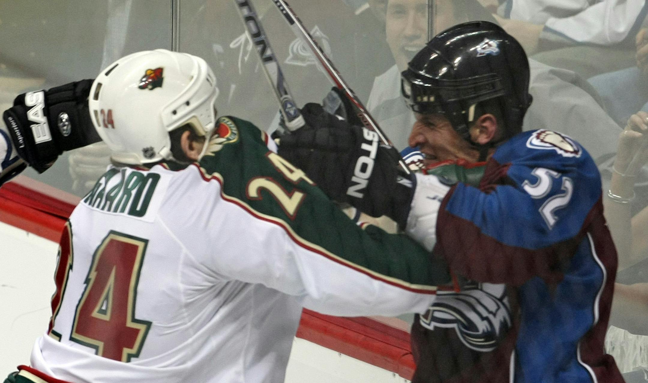 Derek Boogaard tries to rough it up with Adam Foote.