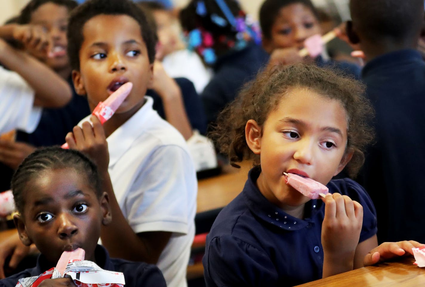 Third graders at Lucy Craft Laney Elementary School enjoy Jonny Pops, a locally-based company that produce low-fat popsicle desserts that meet nutritional guidelines and are made from fruit and ice cream and are now distributed in Minneapolis public schools and seen Thursday, Sept. 8, 2016, at Lucy Craft Laney Elementary School in Minneapolis, MN.(ID'S TO COME)](DAVID JOLES/STARTRIBUNE)djoles@startribune.com Locally-based Jonny Pops, a fruit and ice-cream based company that has major expansion p