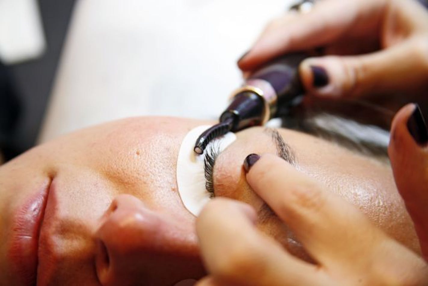 Courtney Akai applies the LashDip product to Amanda Smeal at the Courtney Akai Lash Boutique in New York on Dec. 20, 2010. LashDip, a semipermanent mascara that lasts for up to six weeks, is a gel made of black pigment, acetone and stearic acid that's painted onto the eye fringe.