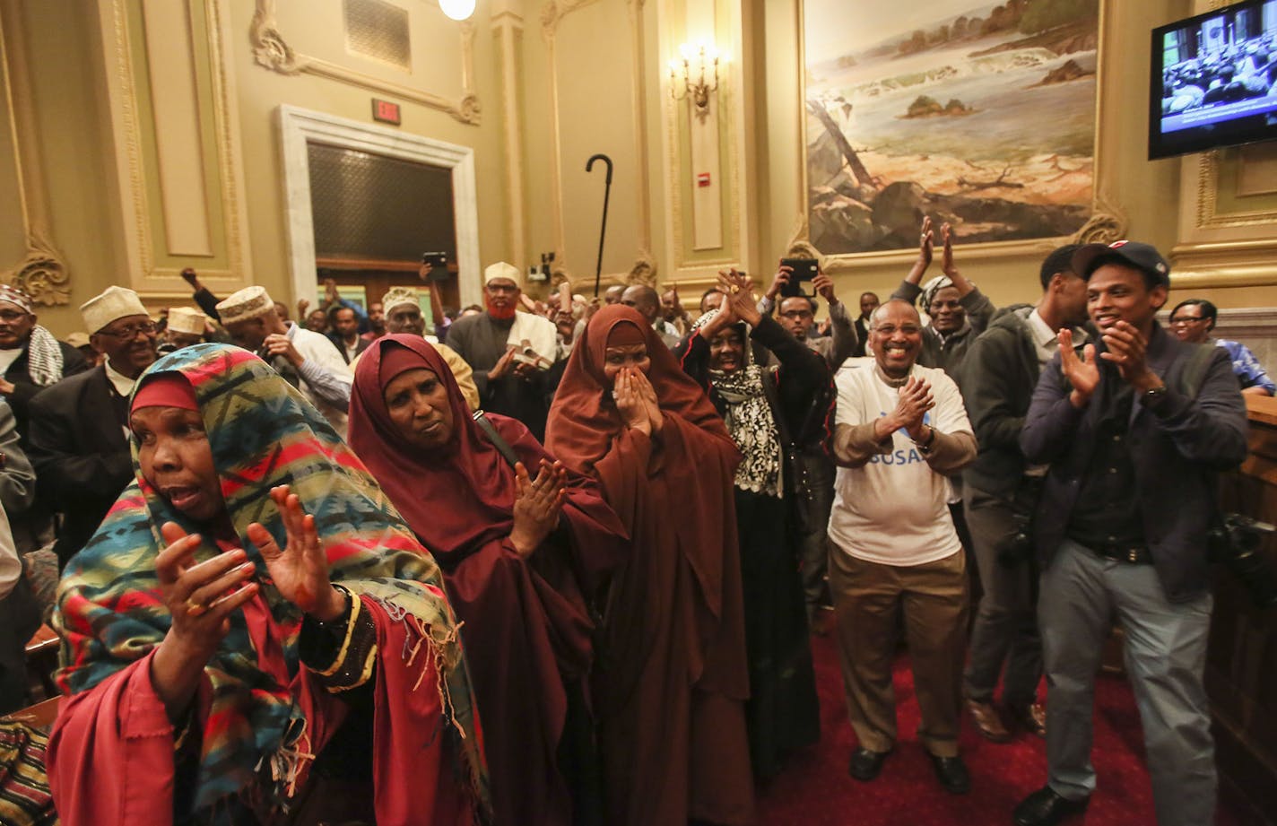 People celebrate after the Minneapolis city council voted to add Bosaso, Somalia as a sister city to Minneapolis Thursday, Oct. 9, 2014, at the Minneapolis City Council chambers in Minneapolis, MN.](DAVID JOLES/STARTRIBUNE)djoles@startribune.com The Minneapolis City Council voted to add Bosaso, Somalia, the country's third largest city and the original home to many Somali Americans in the Twin Cities, as a sister city. The move was the first for any American city and was witnessed by an overflow