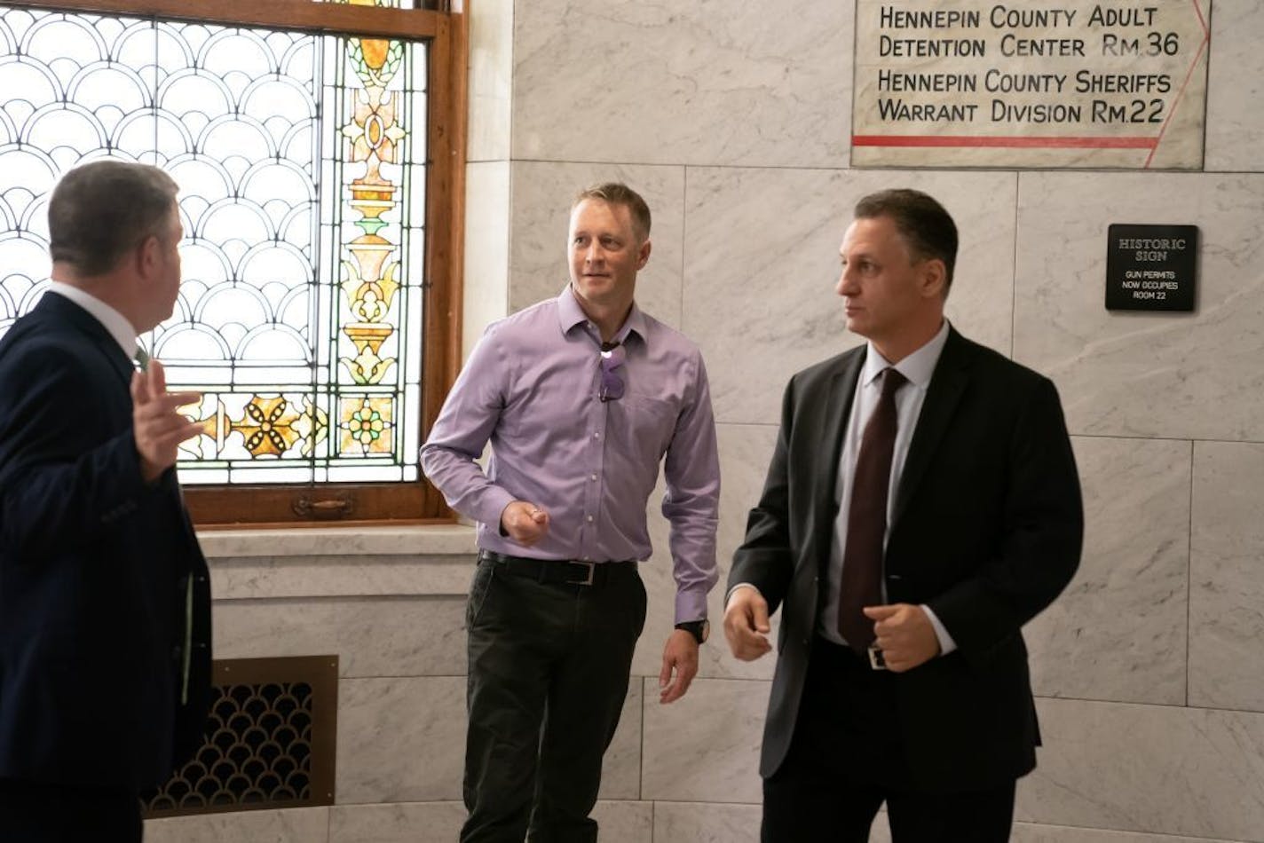 Jason Spiller, center, son of the slain Susan Spiller, attended the press conference. Minneapolis Mayor Jacob Frey, Police Chief Medaria Arradondo and Tom Arneson, Managing Attorney for the Hennepin County Attorney's Office, Juvenile Division, spoke at a press conference to announce the arrest of a suspect in the 2015 murder of Susan Spiller.