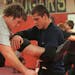 Zane Peterson, left, who is on winter break from Ridgewater College in Willmar, Minn., wrestled with his younger brother Tommy Peterson during practic