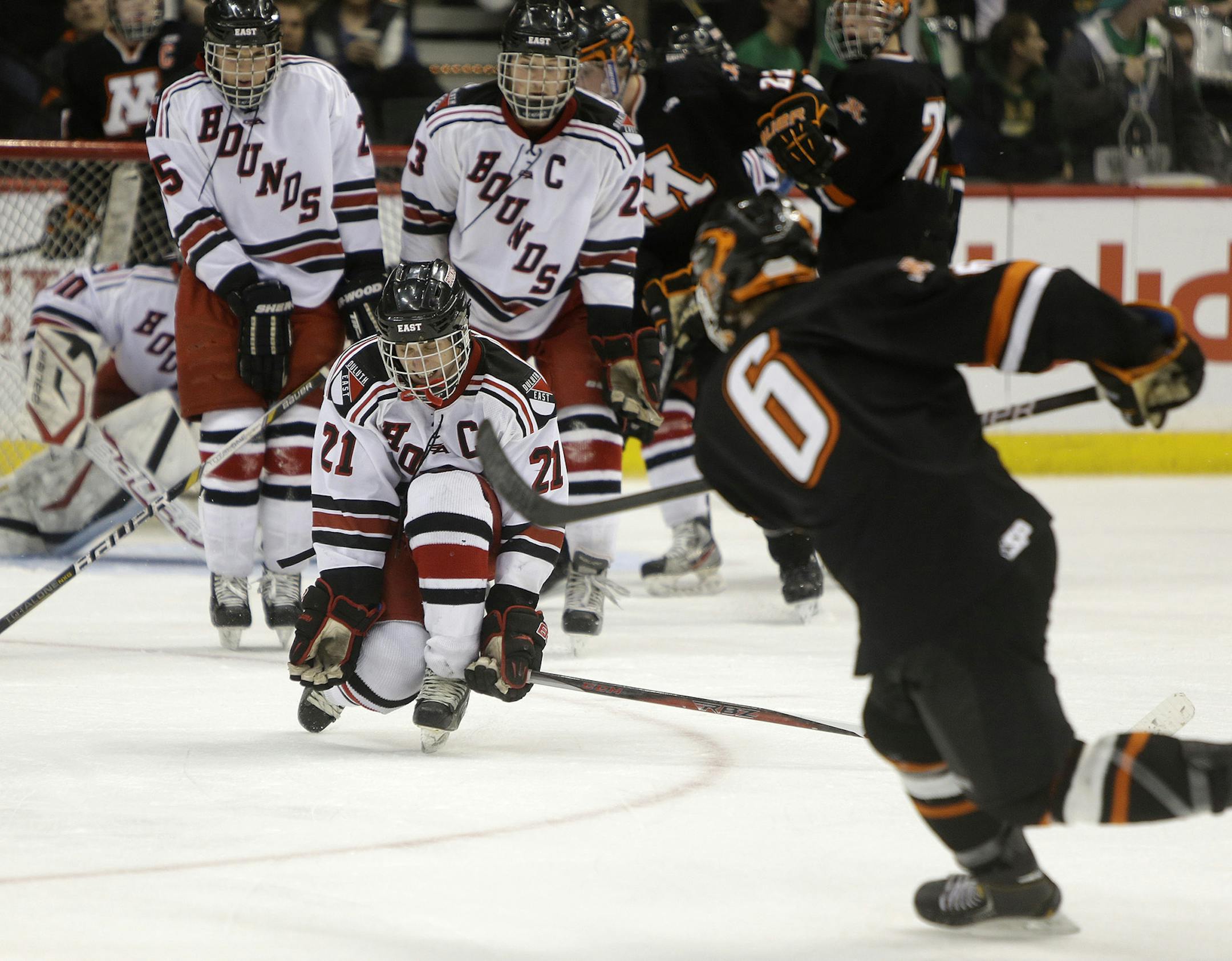 Moorhead's Alex Mehnert made one last effort despite Duluth East's defense during third period during the Class 2A boys' hockey state tournament quarterfinals at the Xcel Energy Center, Thursday, March 7, 2013 in St. Paul, MN.(ELIZABETH FLORES/STAR TRIBUNE) ELIZABETH FLORES • eflores@startribune.com