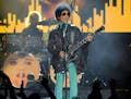 FILE - In this May 19, 2013 file photo, Prince performs at the Billboard Music Awards at the MGM Grand Garden Arena in Las Vegas. Several pills taken 