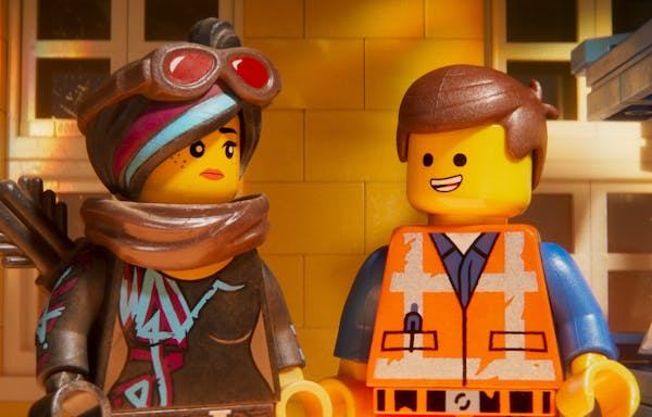 This image released by Warner Bros. Pictures shows the characters Lucy/Wyldstyle, voiced by Elizabeth Banks, left, and Emmet, voiced by Chris Pratt, i