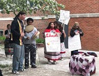 Hinckley-Finlayson students drum and sing last week in protest of a school board decision to bar a tribal drum group from playing during Friday's grad
