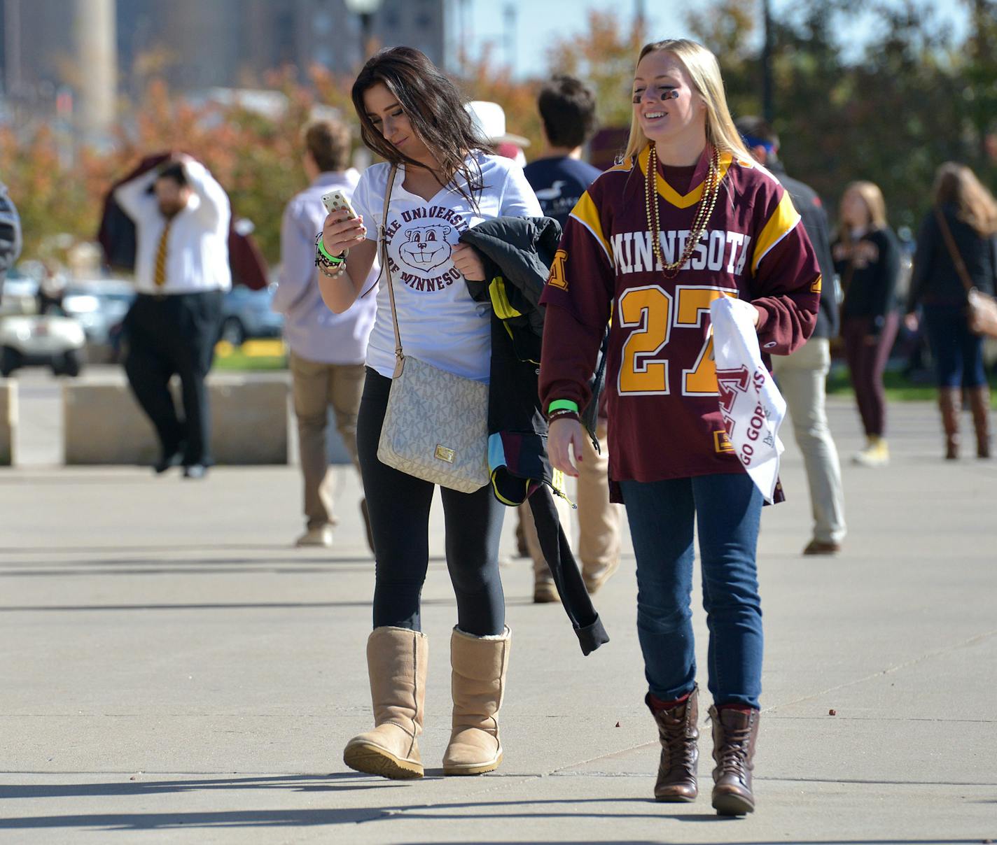 University of Minnesota freshmen, Holly Bloomender (left) and Quinn Harguth blame hunger and the excessive price of concession items at TCF Bank Stadium as their reasons to leave the football against Northwestern University before halftime Saturday, October 11 in Minneapolis. ] (SPECIAL TO THE STAR TRIBUNE/BRE McGEE) **Holly Bloomender (left, brunette, white shirt, University of Minnesota freshman), Quinn Harguth (right, University of Minnesota freshman)