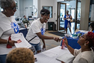 Bridgette Noel and Lesia Jackson asked about pay and job opportunities in the home care field with Renisha Gray of Sisters of Energy at a job fair in 