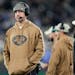 New York Jets quarterback Aaron Rodgers watches from the sidelines against the Los Angeles Chargers during the second half an NFL football game, Monda