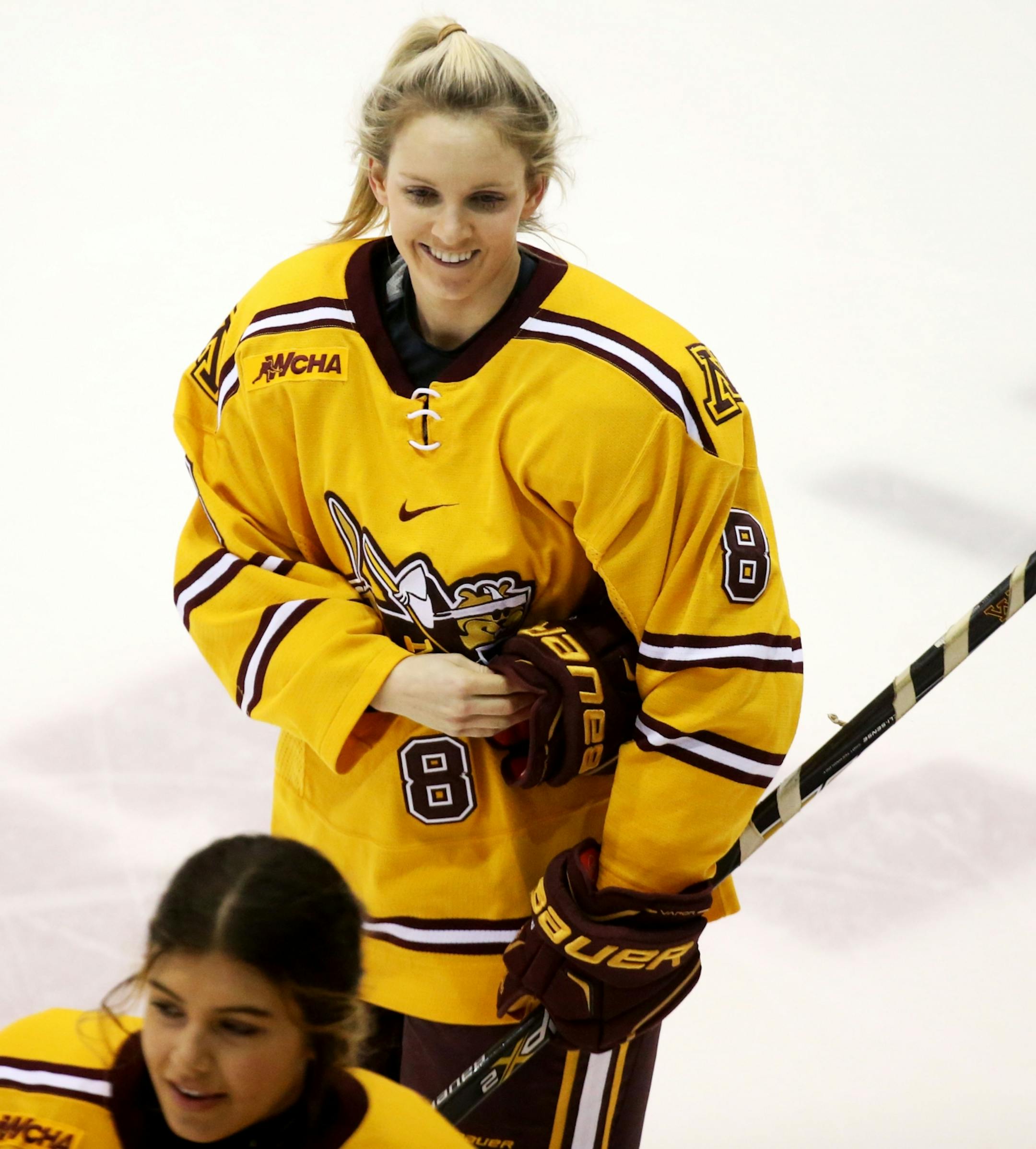 Amanda Kessel (8) wore a smile after game warmups Friday, Feb. 5, 2016, at Ridder Arena on the campus of the University of Minnesota in Minneapolis, MN.