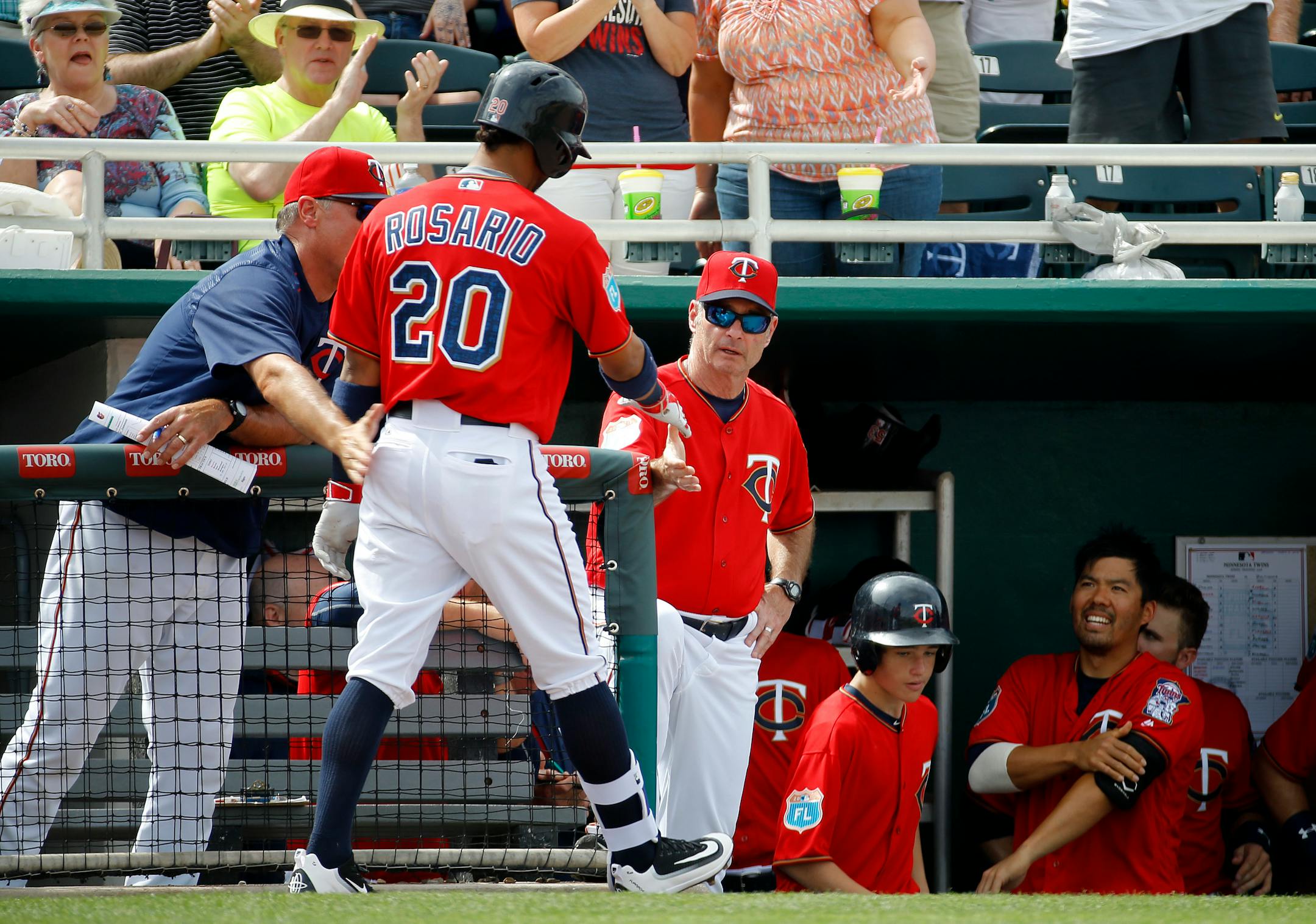 Twins manager Paul Molitor, center, greeted Eddie Rosario after his solo home run in the fourth inning of a spring training game against the Orioles in Fort Myers, Fla., on Saturday. Baltimore won 8-1.