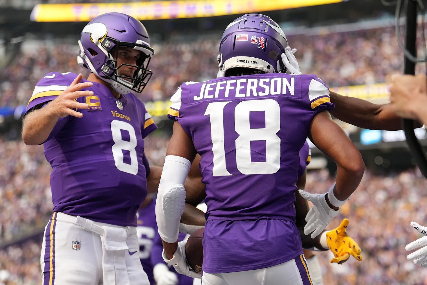 Minnesota Vikings quarterback Kirk Cousins (8) congratulated wide receiver Justin Jefferson (18) after he scored a touchdown in the first quarter of the Minnesota Vikings season opener against the Green Bay Packers Sunday, Sept. 11, 2022 at U.S. Bank Stadium in Minneapolis. ] ANTHONY SOUFFLE • anthony.souffle@startribune.com