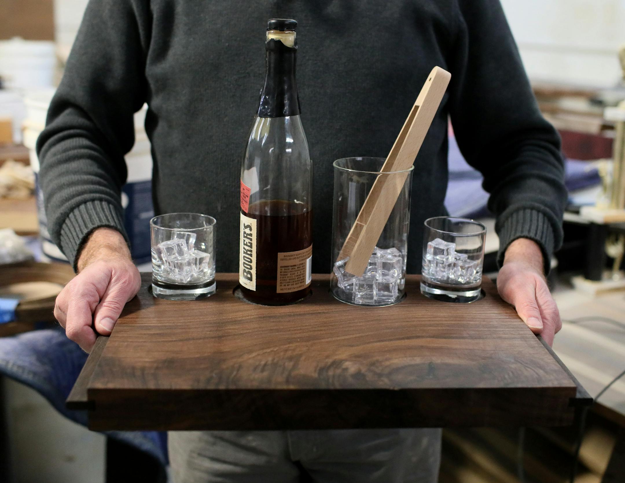 Willie Willette held a bourbon board made of solid walnut.