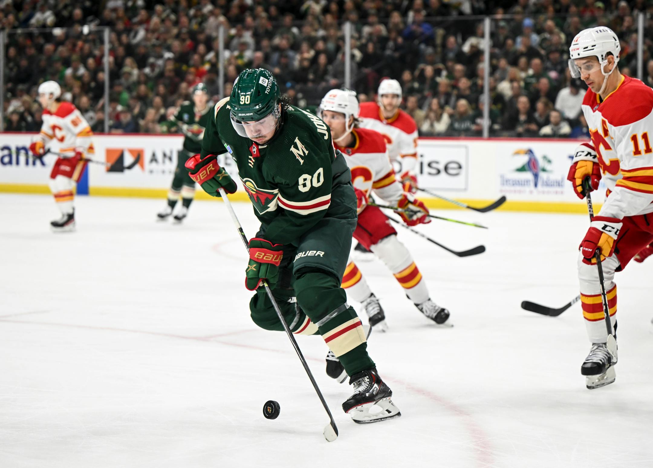 Minnesota Wild left wing Marcus Johansson (90) controls the puck against the Calgary Flames during the first period.