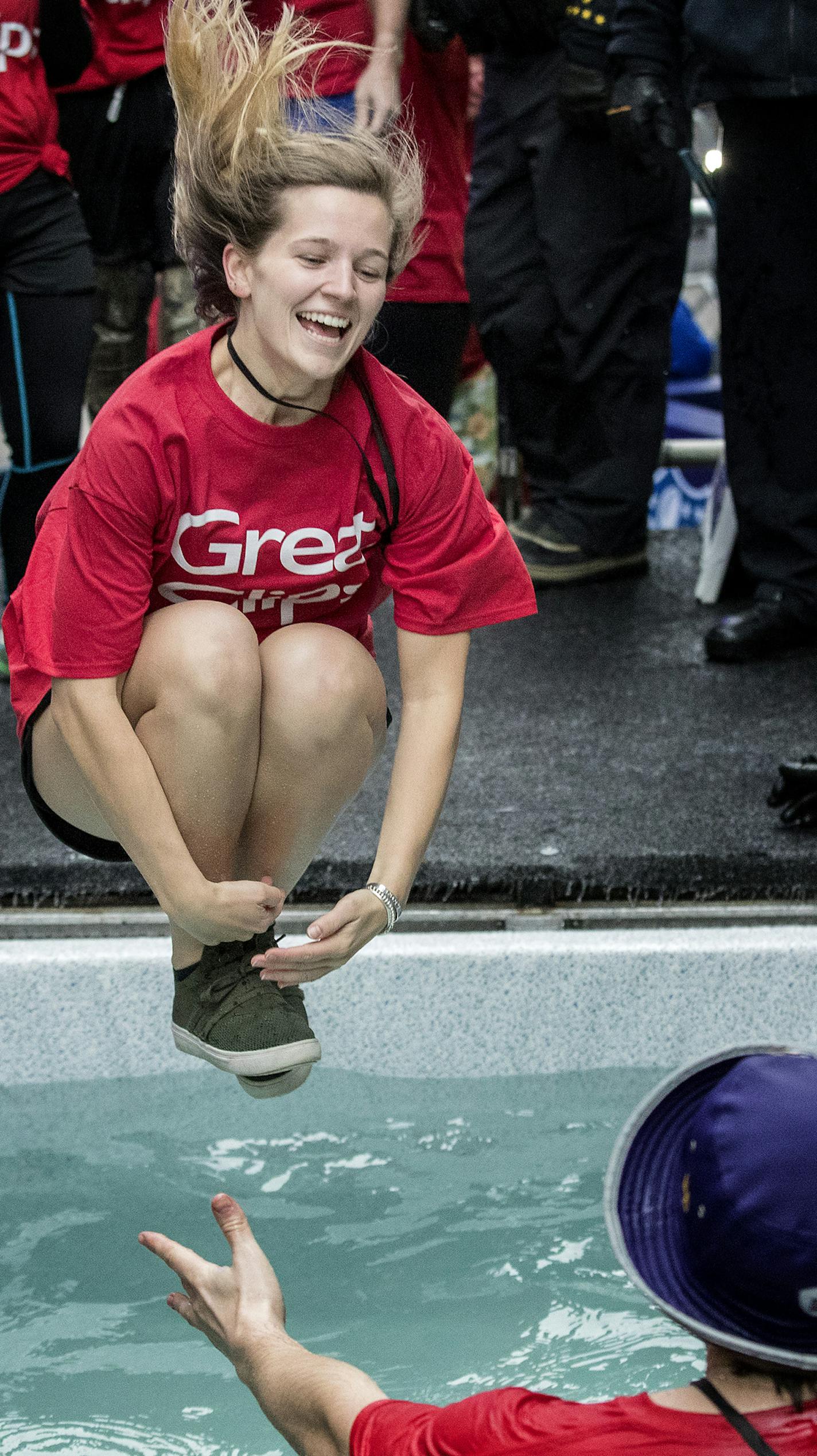 Emily Phelps, 24, of Orono jumped toward Marc Massie, 27 of Minneapolis during the Polar Plunge at Super Bowl Live on Nicollet Mall in Minneapolis. ] CARLOS GONZALEZ &#x2022; cgonzalez@startribune.com - Minneapolis, MN - January 30, 2018 - Polar Plunge Super Bowl Live at the Verizon stage on Nicollet Mall at 8th Street.