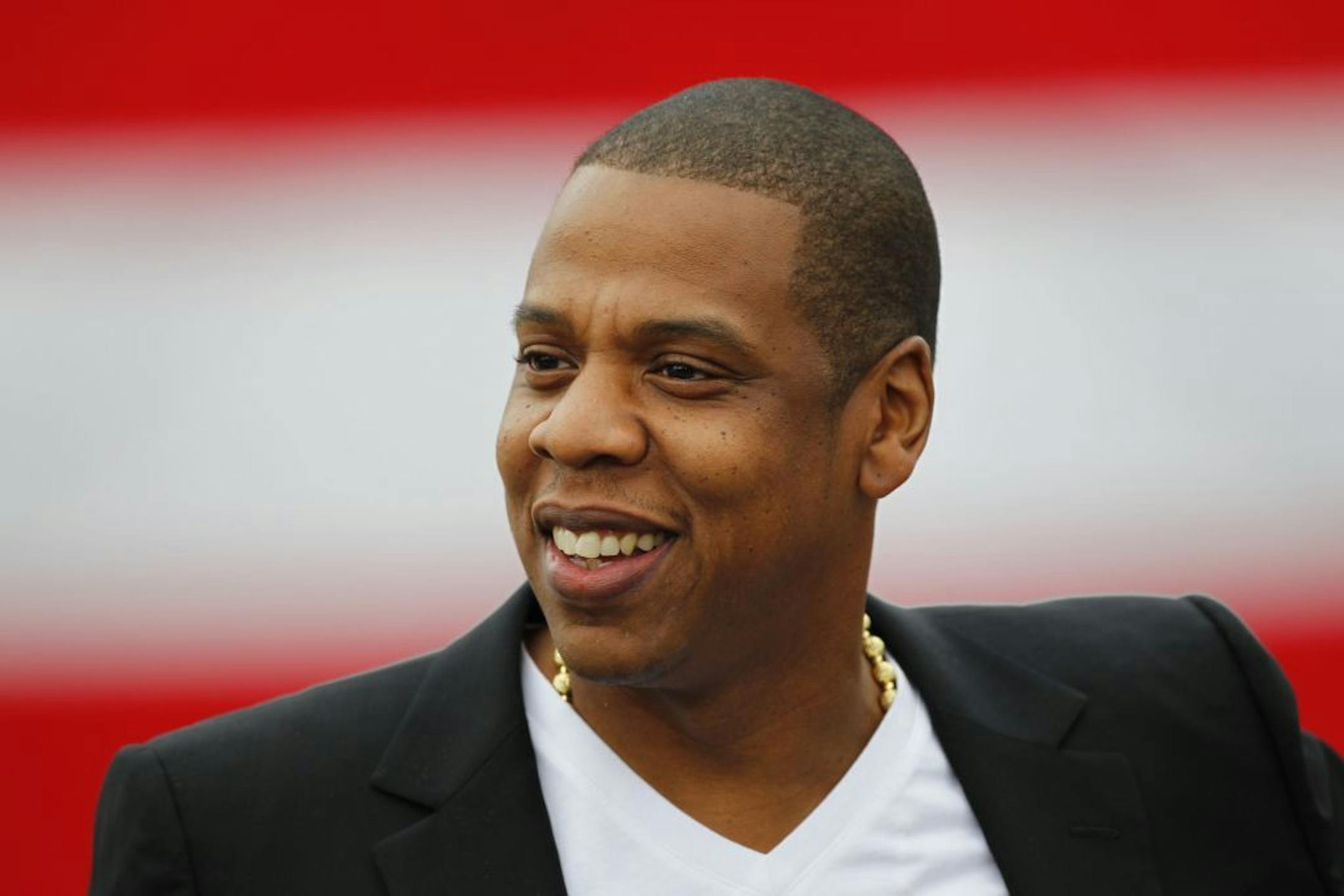 Entertainer Shawn "Jay-Z" Carter smiles during a news conference at the Philadelphia Museum of Art, Monday, May 14, 2012, in Philadelphia. The rapper announced plans for a two-day music festival in Philadelphia's at Fairmount Park, featuring nearly 30 acts "that embody the American spirit" on Labor Day weekend, Sept. 1 and Sept. 2, 2012.