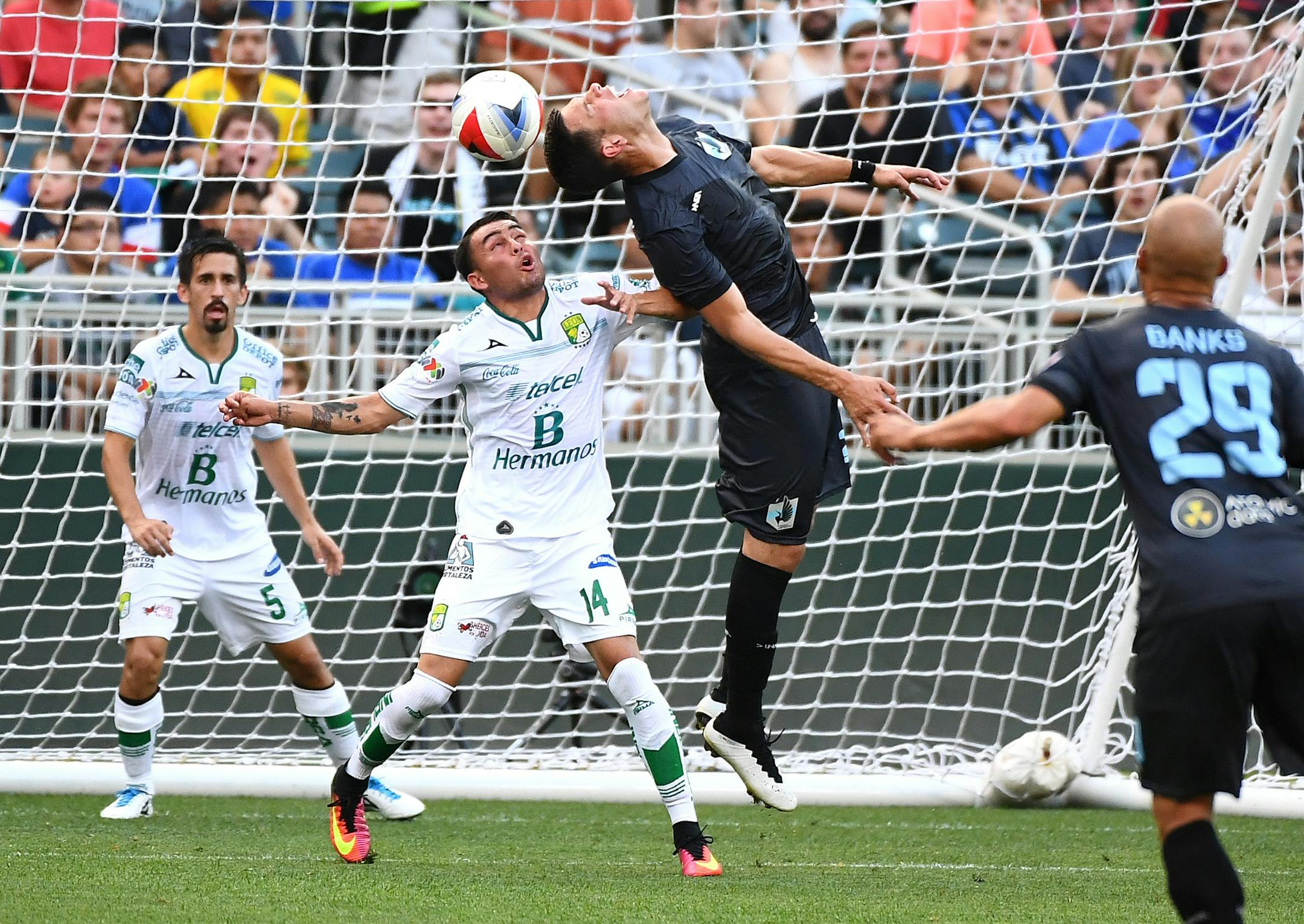 Minnesota United FC forward Christian Ramirez (21) was unable to score off a corner kick while being defended by Club Leon's Miguel Ibarra in the first half. ] (AARON LAVINSKY/STAR TRIBUNE) aaron.lavinsky@startribune.com Minnesota United played the León Fútbol Club on Saturday, June 25, 2016 at Target Field in Minneapolis, Minn.