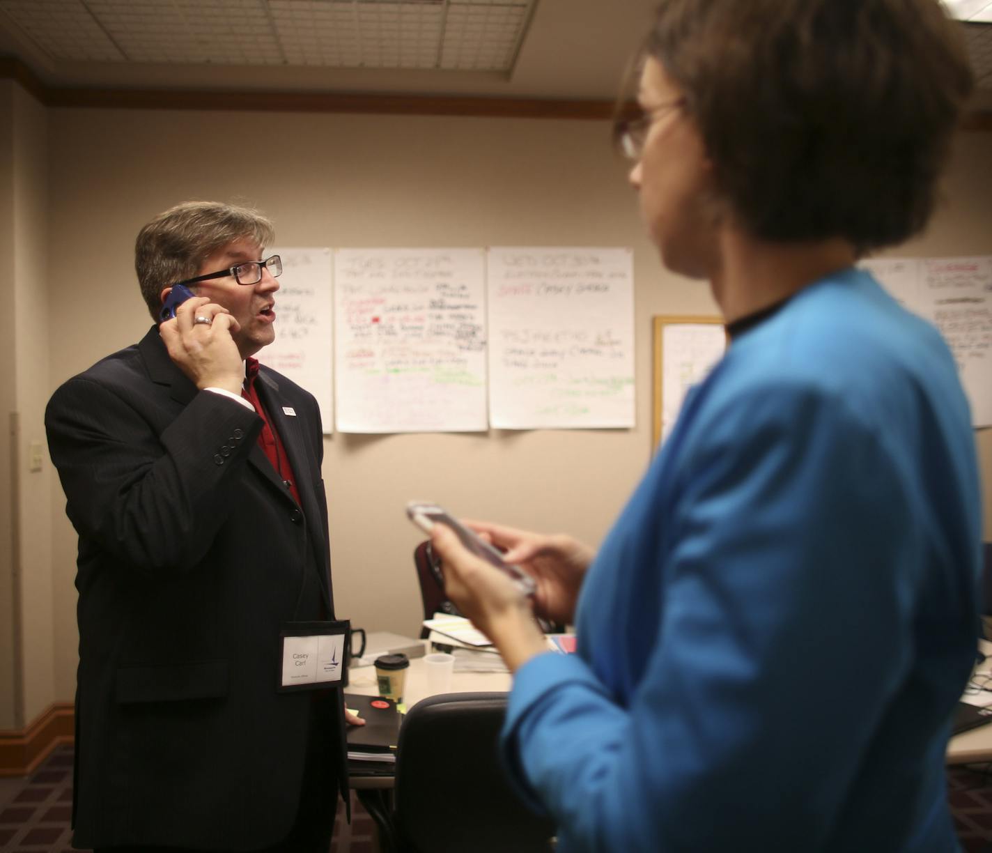 Minneapolis City Clerk Casey Carl was at the center of the city's first Ranked Choice Voting election on Tuesday, November 5, 2013. He was overseeing preparations for tabulating at City Hall as voting took place across the city. City Clerk Casey Carl touched base with Anissa Hollingshead of his office when they were both briefly in a conference room Tuesday afternoon that's been converted to a command center for the city's first RCV election. ] JEFF WHEELER &#x201a;&#xc4;&#xa2; jeff.wheeler@star