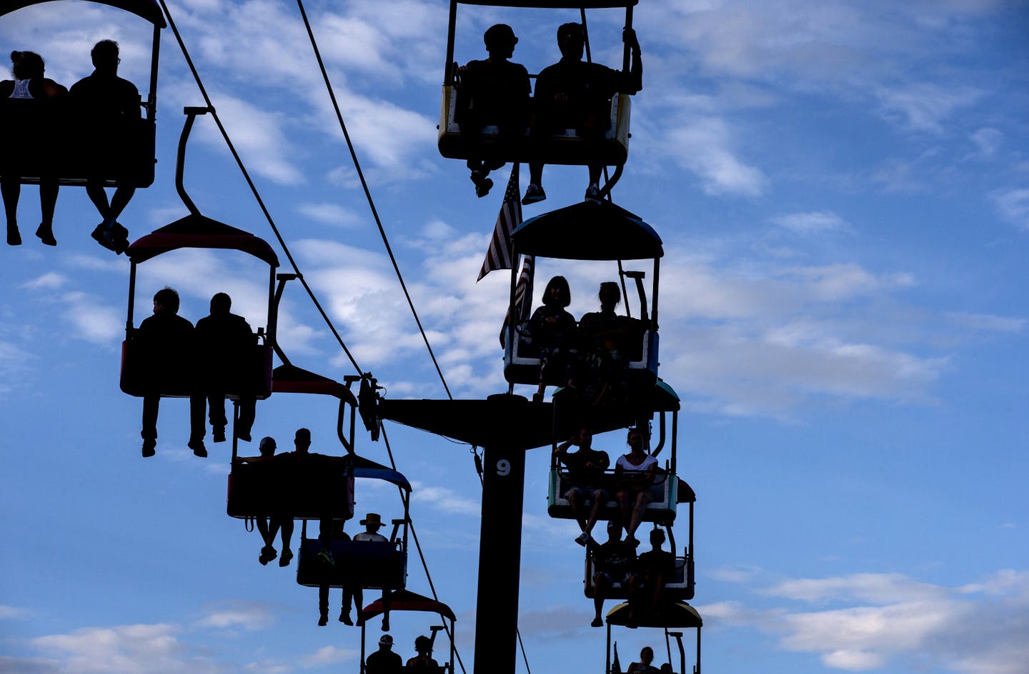 Fairgoers ride on the SkyGlider